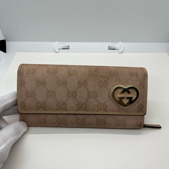 Gucci Handbags - Pre owned Gucci Tan Wallet with Heart Detail